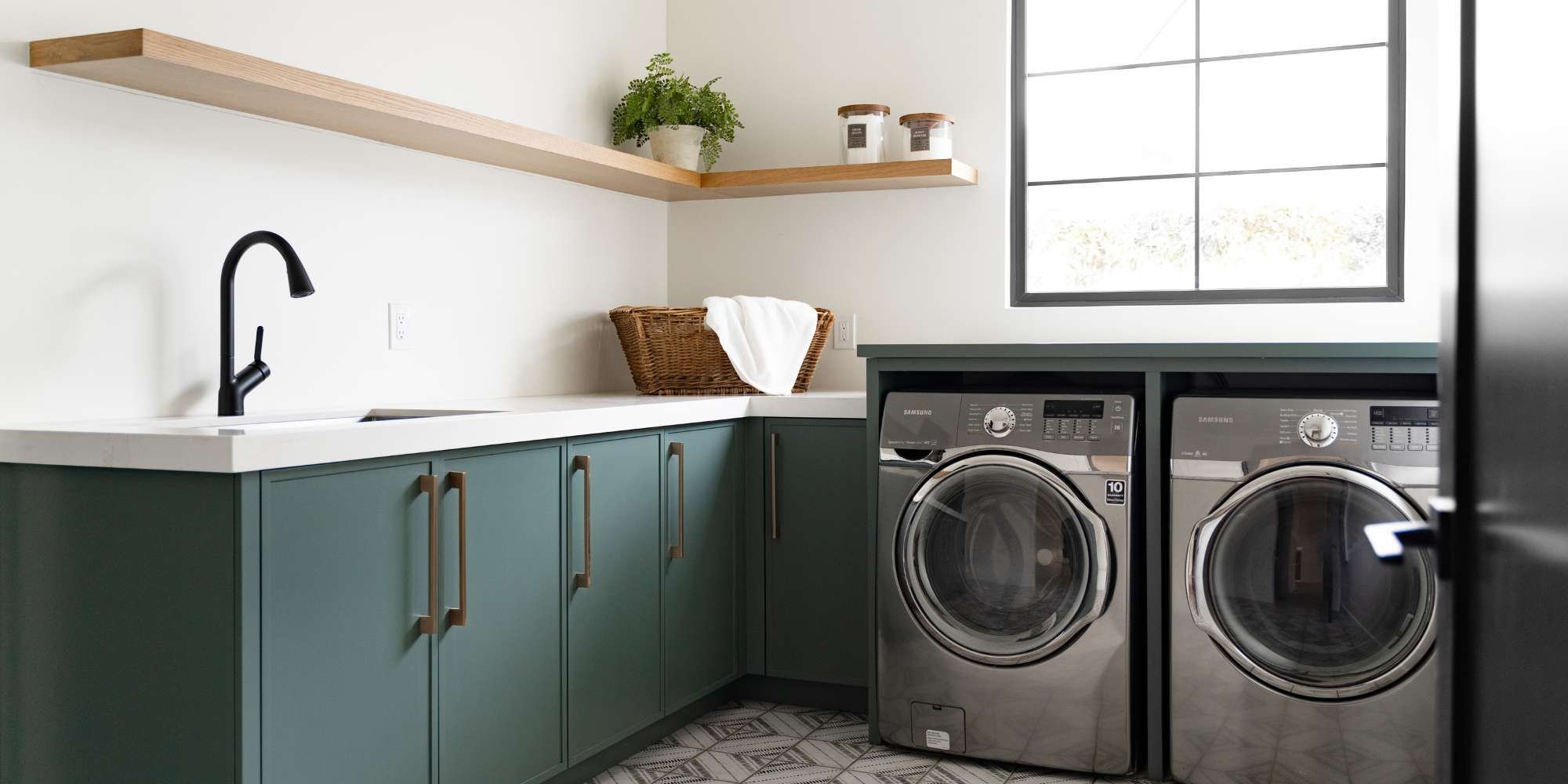 Energy efficient appliances in a remodeling laundry room by Trinity Homes AZ