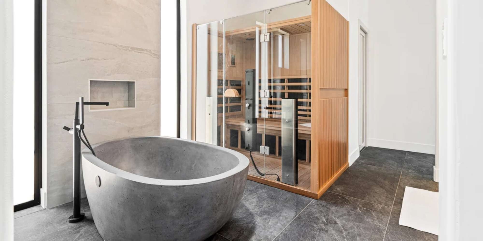 Spa-Like primary suite with stone tub and sauna by Trinity Homes AZ