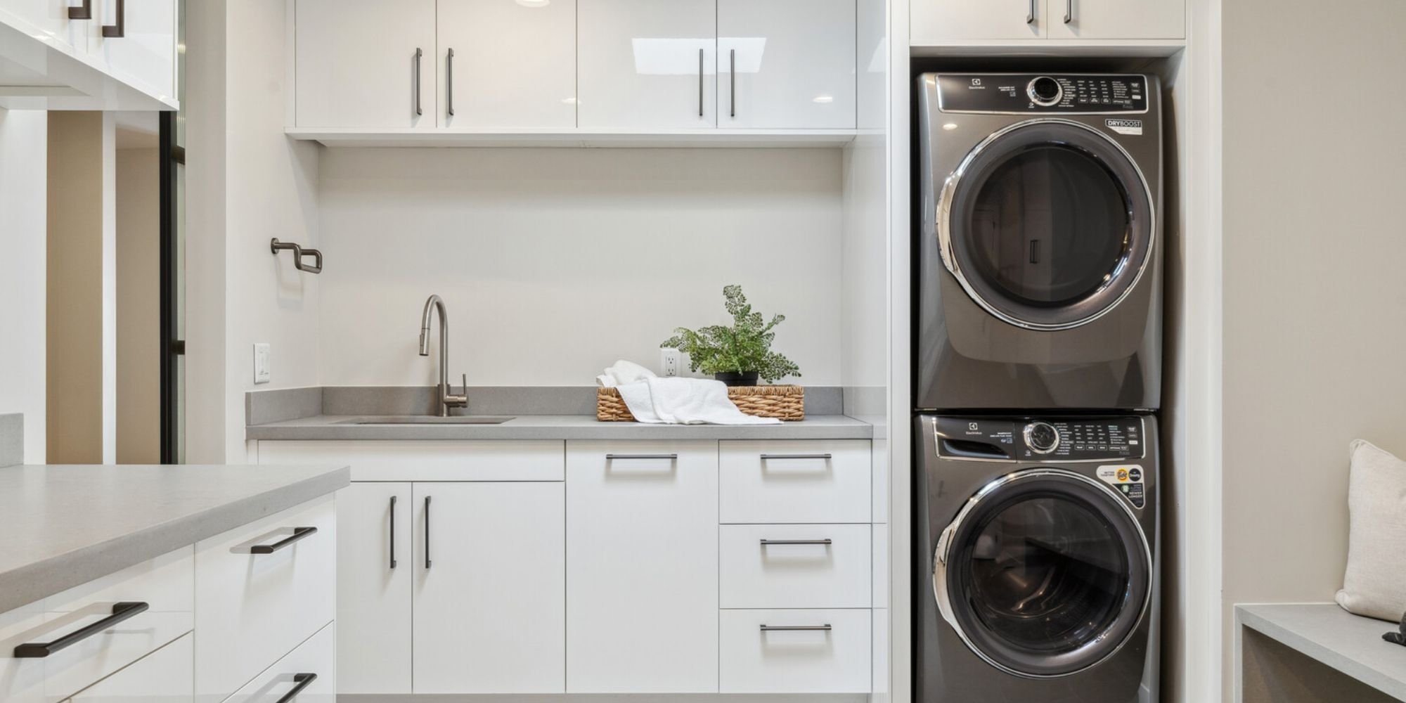Home addition laundry space in Scottsdale by Trinity Homes AZ with sleek counters and efficient storage