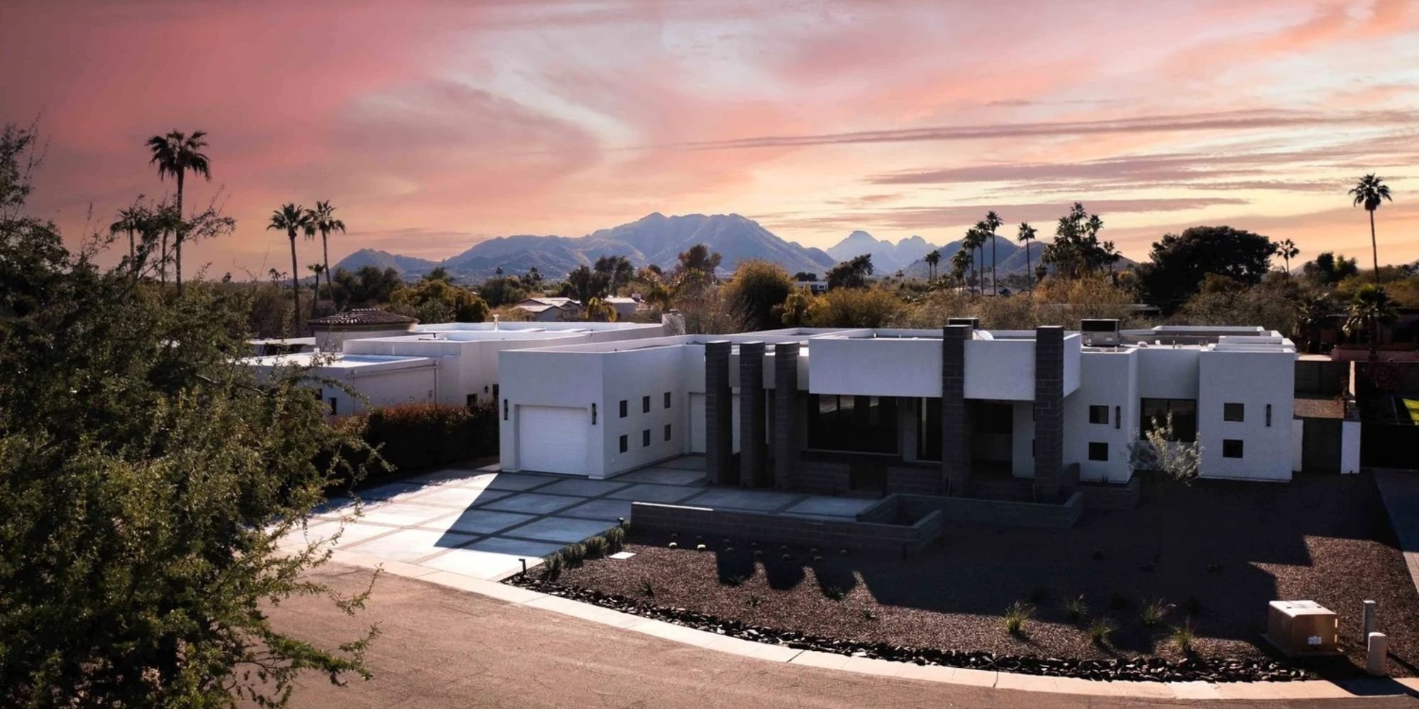 Contemporary custom home by Trinity Homes AZ in Scottsdale AZ with mountain views and desert landscaping