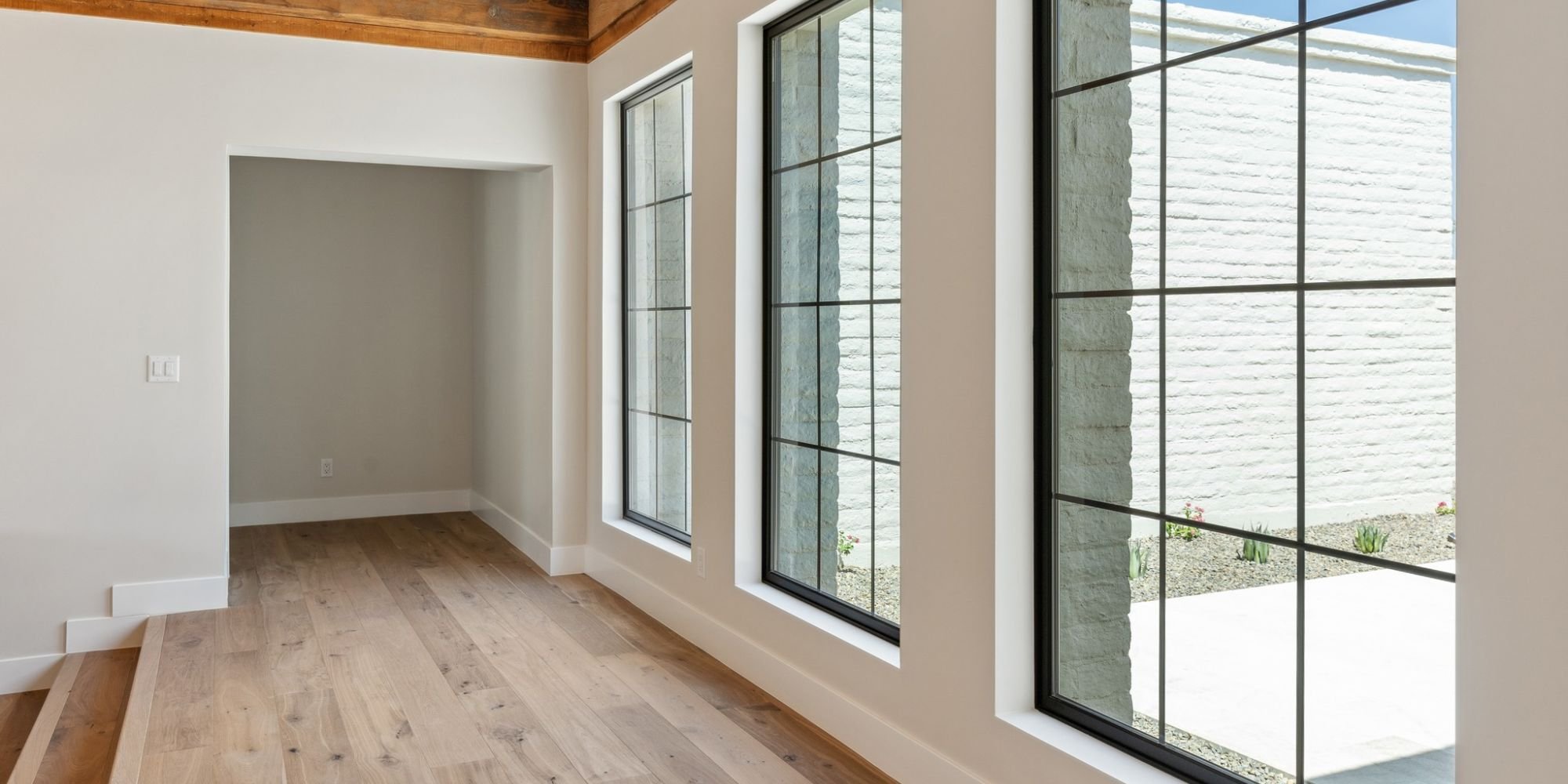 Interior hallway in a Trinity Homes AZ custom build in Scottsdale AZ with natural light and modern finishes