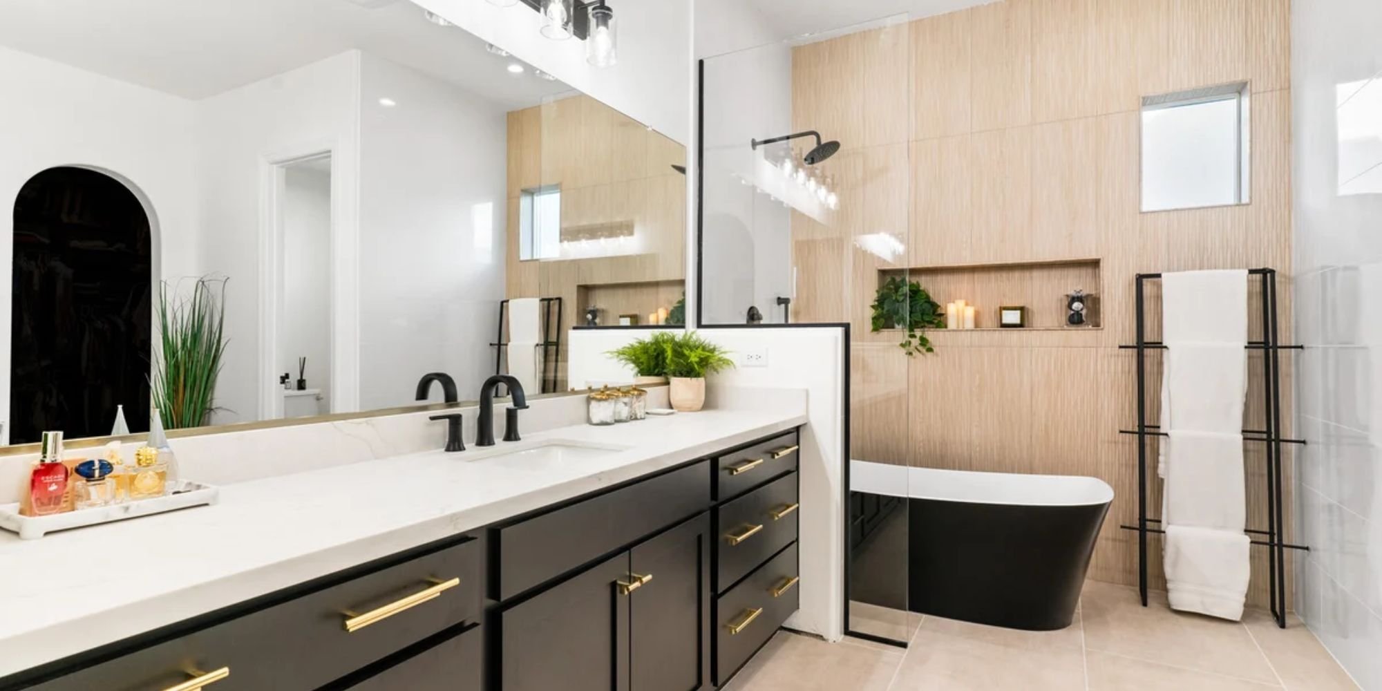 Contemporary bathroom renovation featuring double sinks and glass-enclosed shower in Arizona