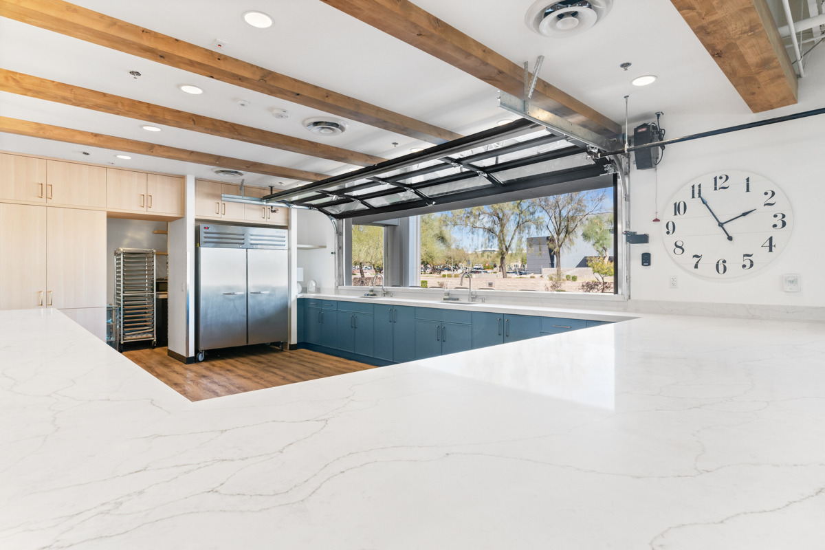 Spacious kitchen corner with commercial refrigerator by Trinity Homes in Scottsdale