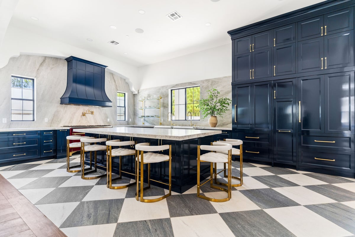 Bright Scottsdale kitchen remodel with bold blue cabinetry and brass fixtures by Trinity Homes