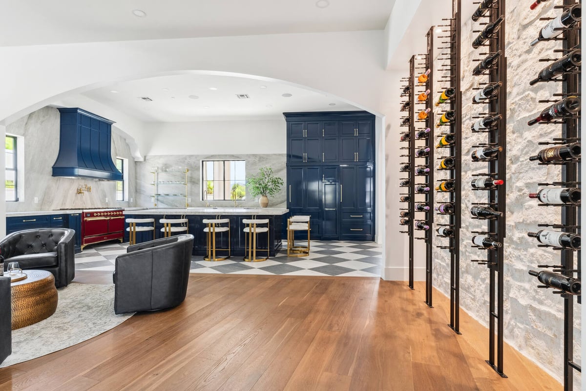 Custom wine wall and luxury kitchen in Scottsdale whole home remodel by Trinity Homes
