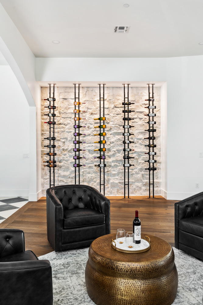 Modern wine wall display in Scottsdale living space remodeled by Trinity Homes