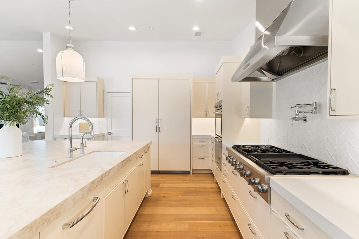 Built-in double oven and oversized island in Scottsdale AZ kitchen remodel by Trinity Homes