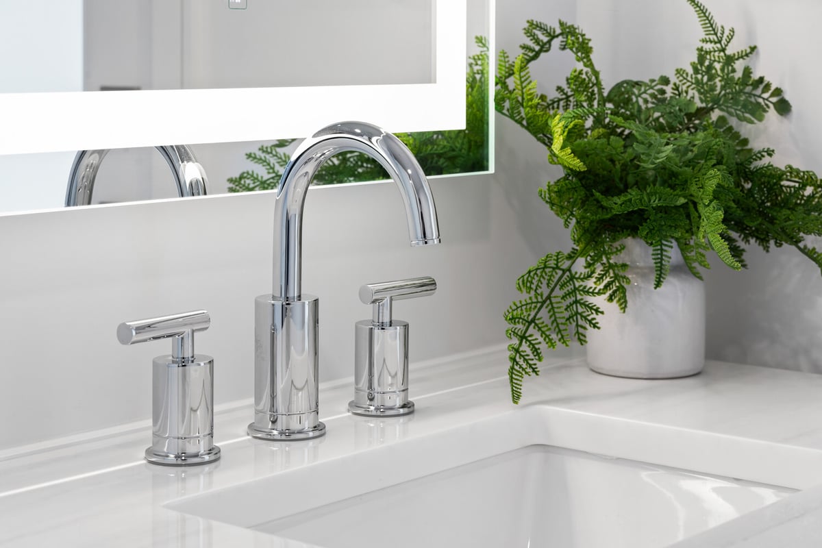 Chrome faucet and vanity detail in a Scottsdale bathroom remodeled by Trinity Homes
