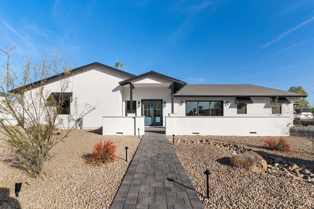 Exterior of a modern white home remodeled in Scottsdale, AZ by Trinity Homes