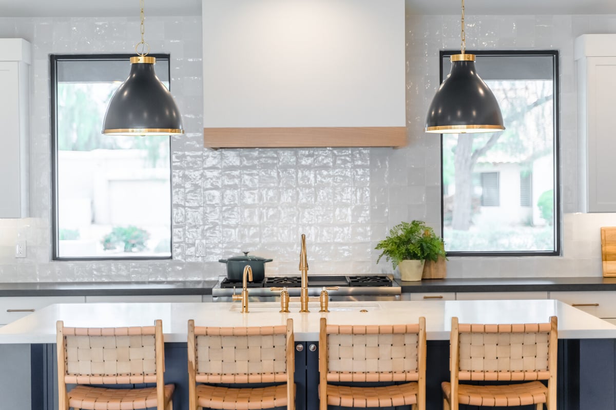 Centered kitchen island view with symmetrical pendant lights by Trinity Homes AZ in Arcadia, AZ
