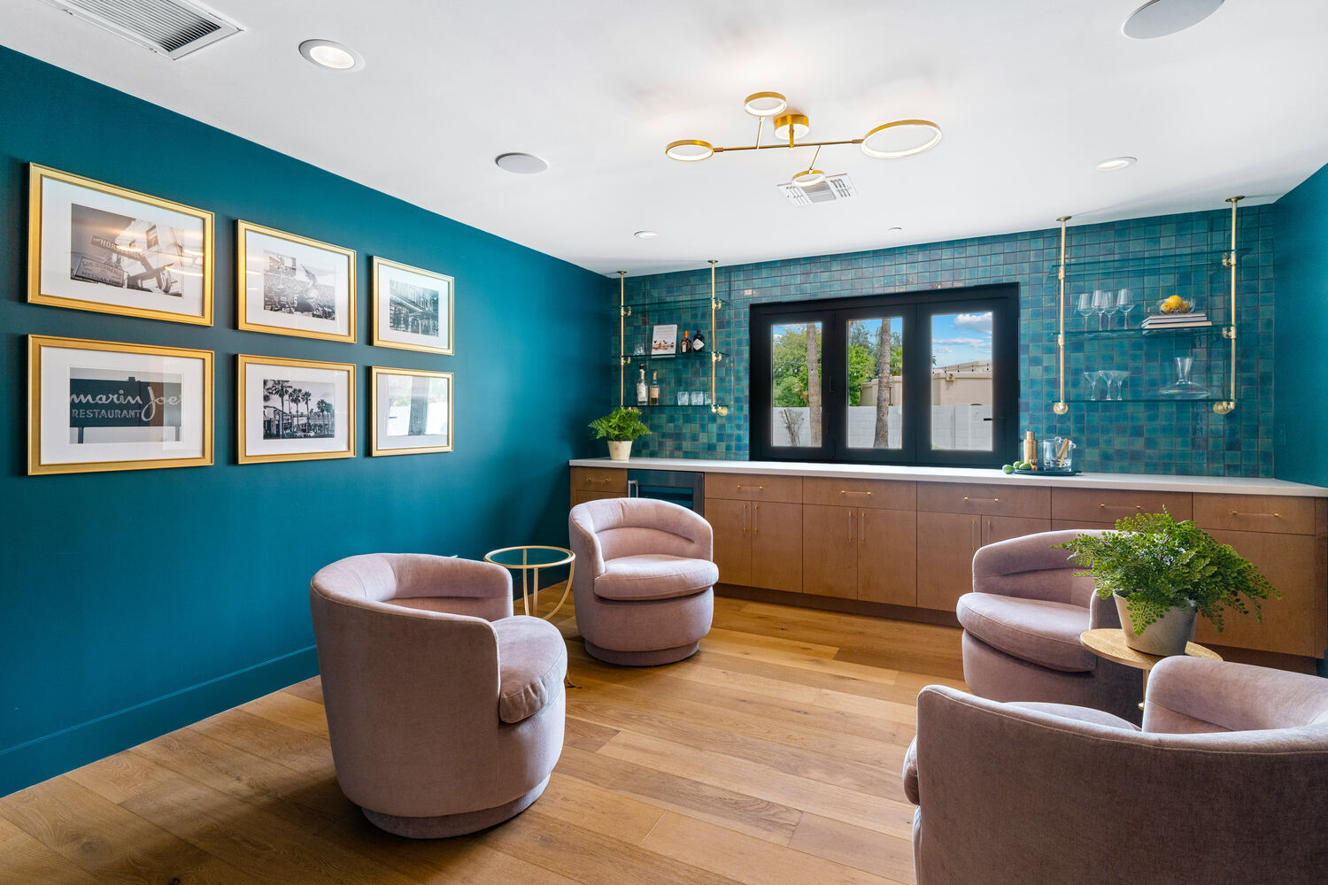 Cozy conversation nook with art wall and custom bar by Trinity Homes AZ in Arcadia, AZ