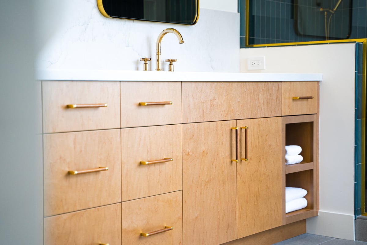 Custom-built vanity with white quartz top and gold accents by Trinity Homes AZ in Chandler, AZ