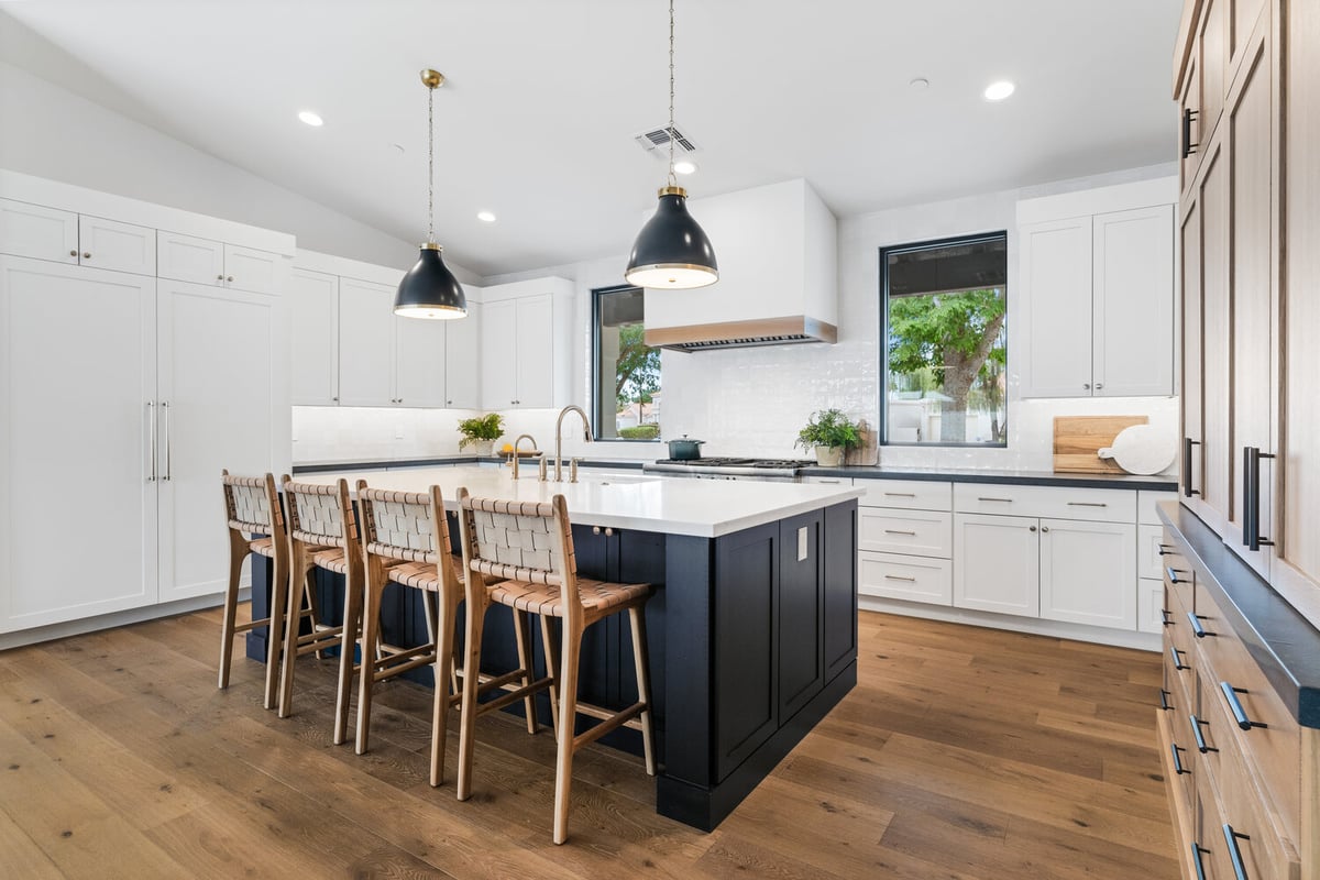 High-end kitchen remodel with wood floors and modern cabinetry by Trinity Homes AZ in Mesa, AZ