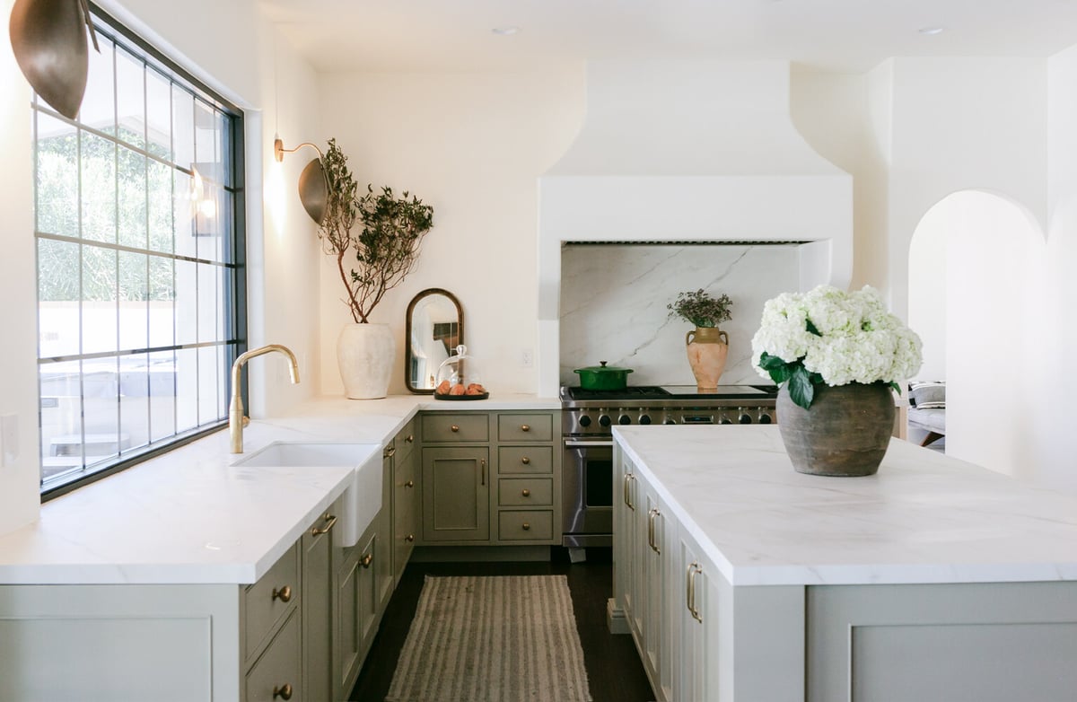 Elegant kitchen remodel in Phoenix, AZ by Trinity Homes featuring marble countertops and soft sage cabinetry