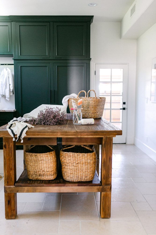 Trinity Homes Phoenix remodel showcasing rustic wood island and built-in storage baskets