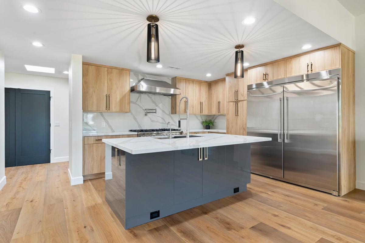 Spacious kitchen island and pendant lighting in Scottsdale, AZ whole home remodel by Trinity Homes