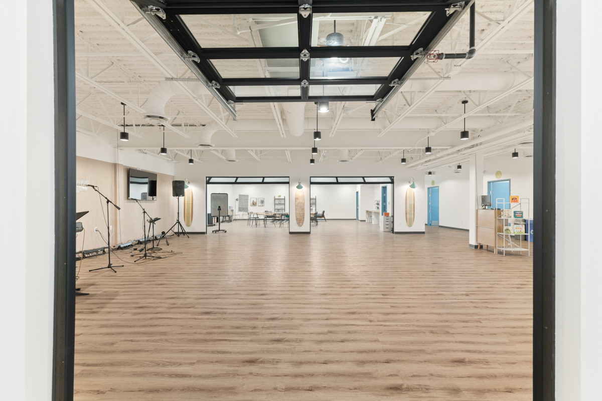 Large multipurpose room with wood flooring in Scottsdale commercial remodel by Trinity Homes