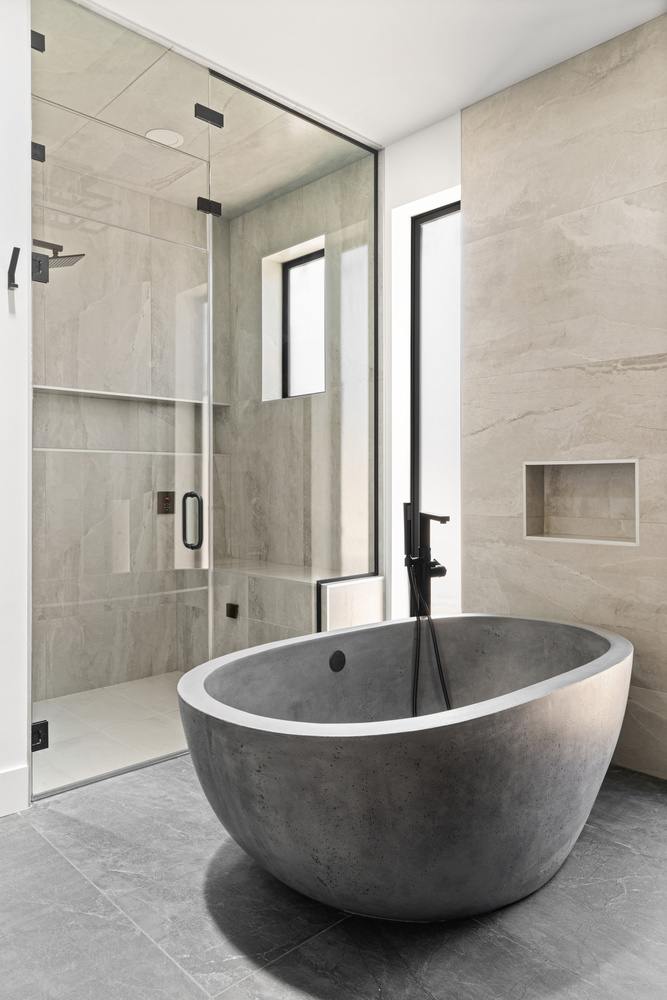 Luxurious freestanding bathtub and tiled shower in North Peoria custom home by Trinity Homes AZ