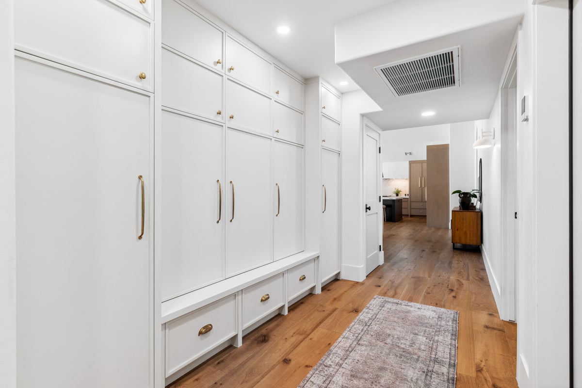 Built-in hallway storage with white cabinetry in a Gilbert, AZ home by Trinity Homes
