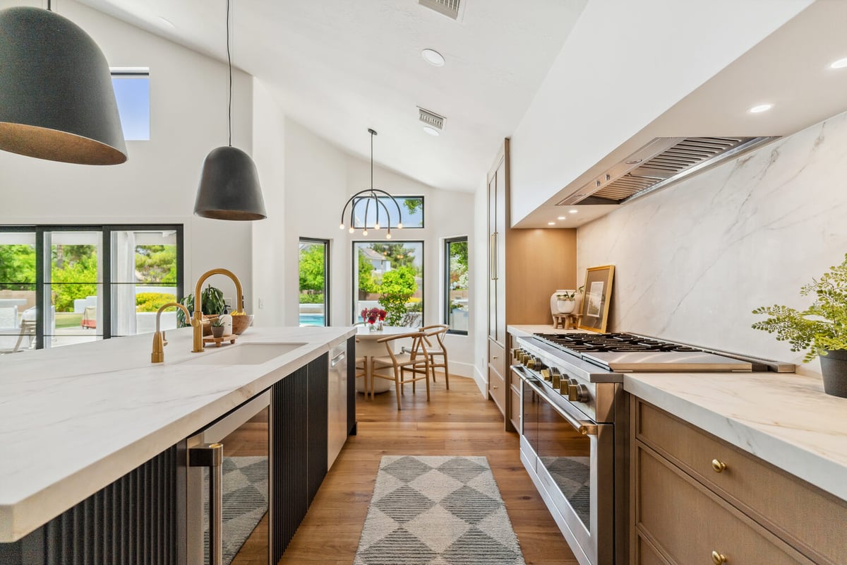 Custom pantry design with open shelving and built-in storage by Trinity Homes in Gilbert, AZ