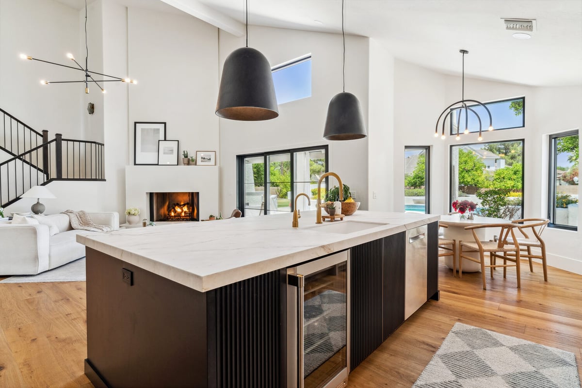 Open-concept kitchen and living area in a modern whole home remodel by Trinity Homes in Gilbert, AZ