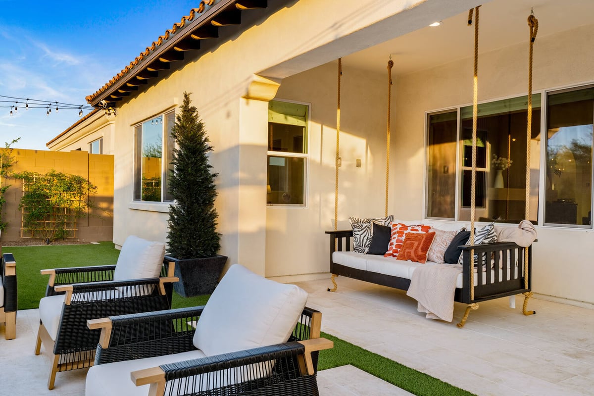 Backyard fireplace seating area in Phoenix partial remodel by Trinity Homes