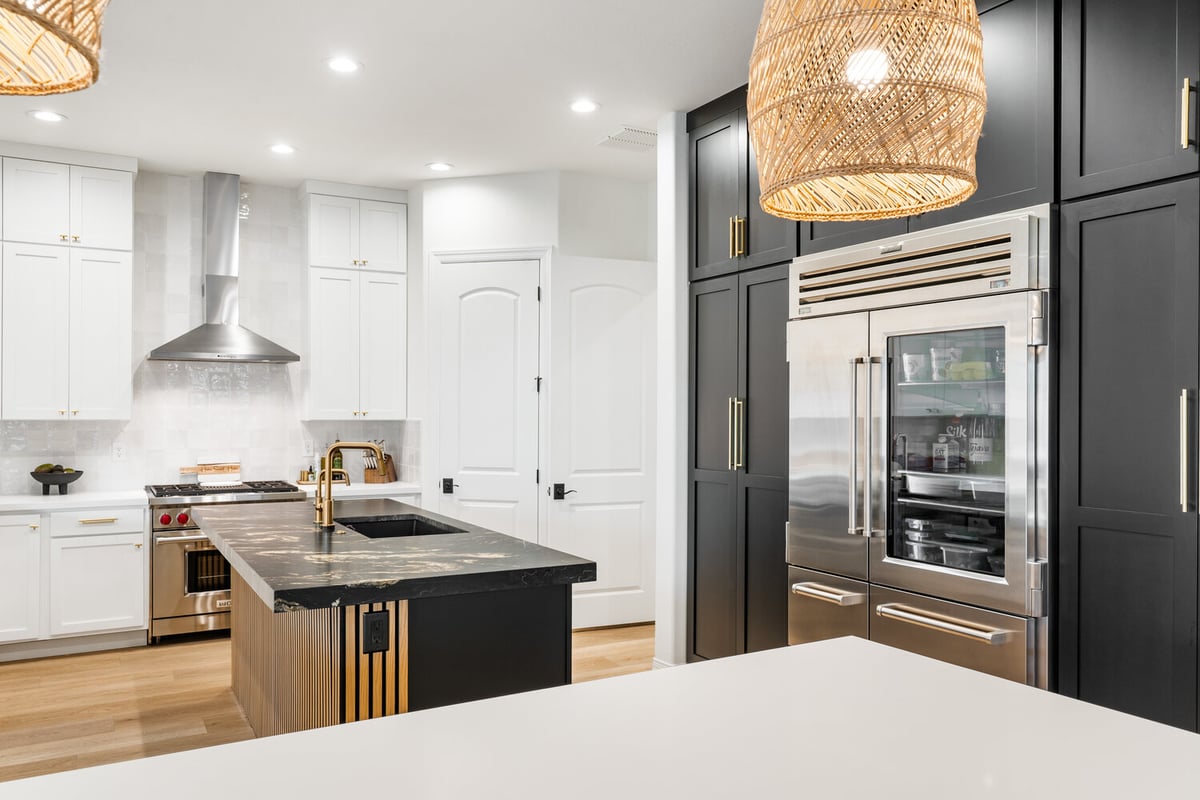 Custom Phoenix kitchen by Trinity Homes with Wolf range and marble backsplash