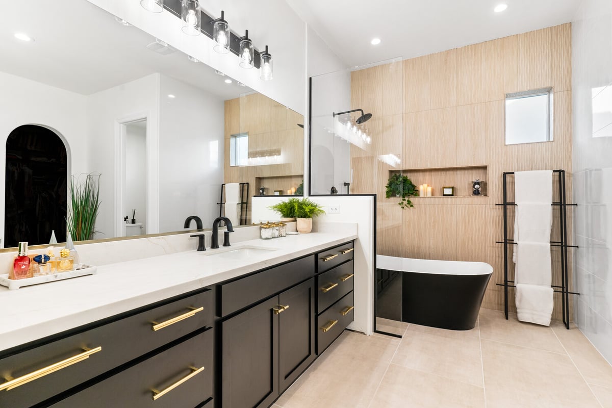 Freestanding tub and spa-style niche in Phoenix bathroom remodel by Trinity Homes