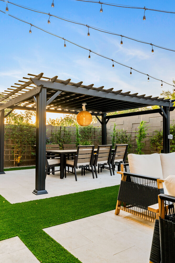 Modern outdoor fireplace with seating from Phoenix remodel by Trinity Homes