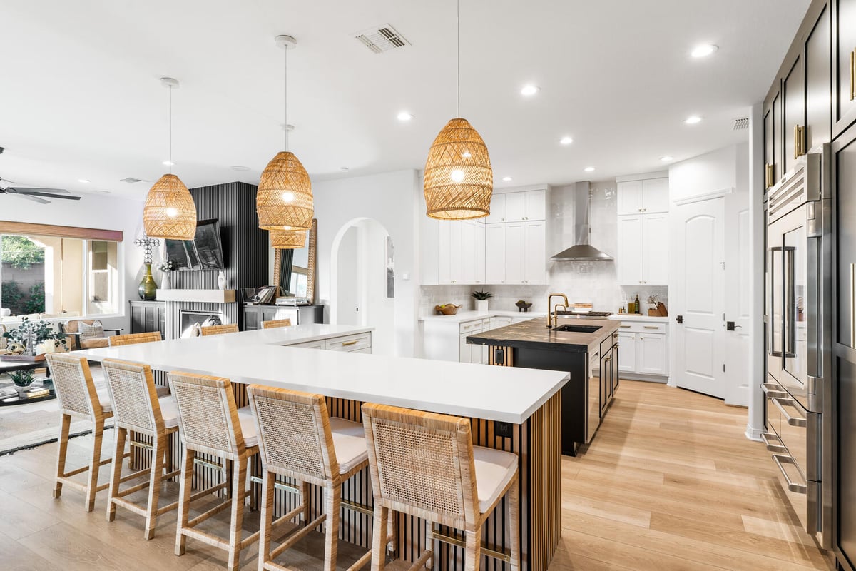 Trinity Homes kitchen remodel in Phoenix with dual islands and rattan pendant lights