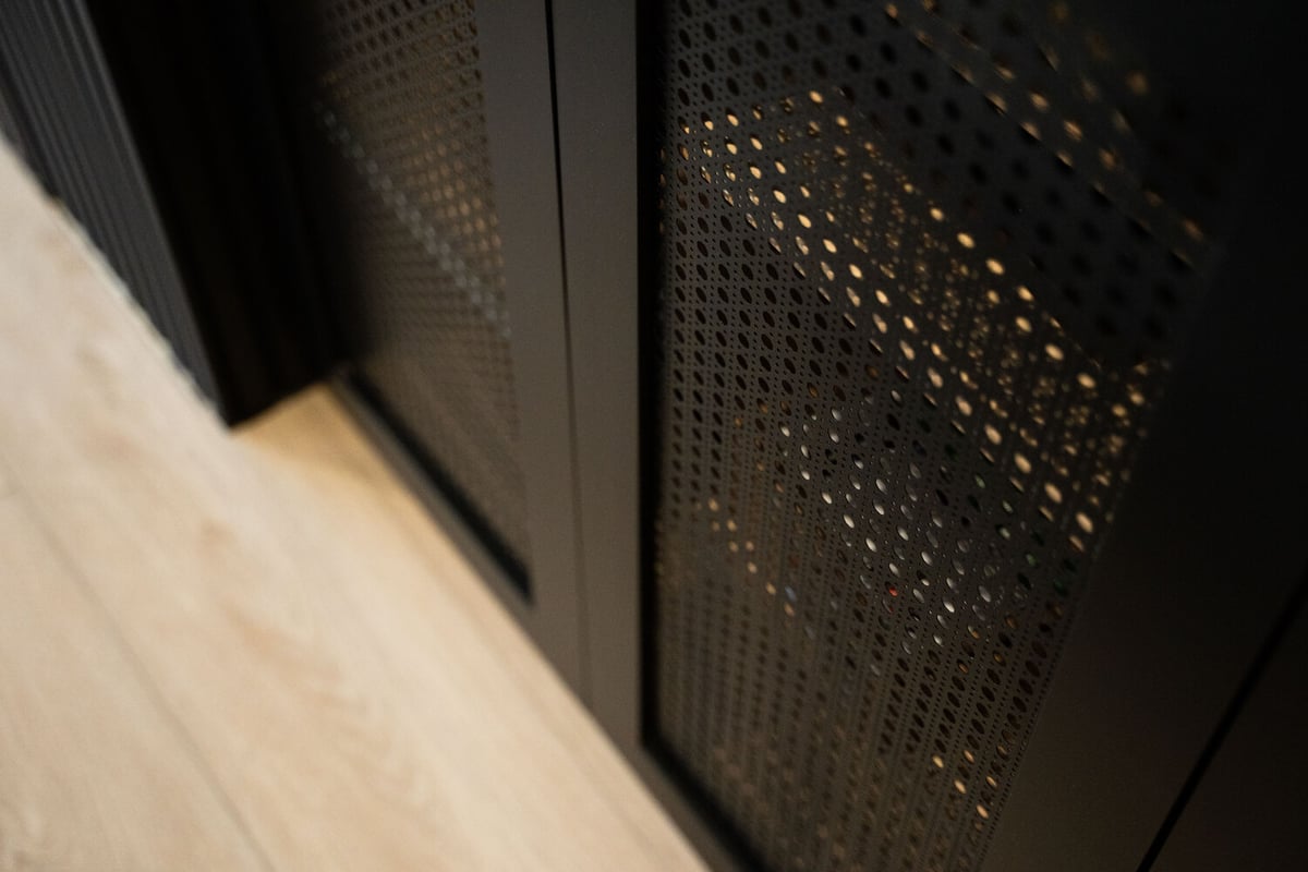 Wood slat paneling detail beneath counter in Trinity Homes Phoenix remodel