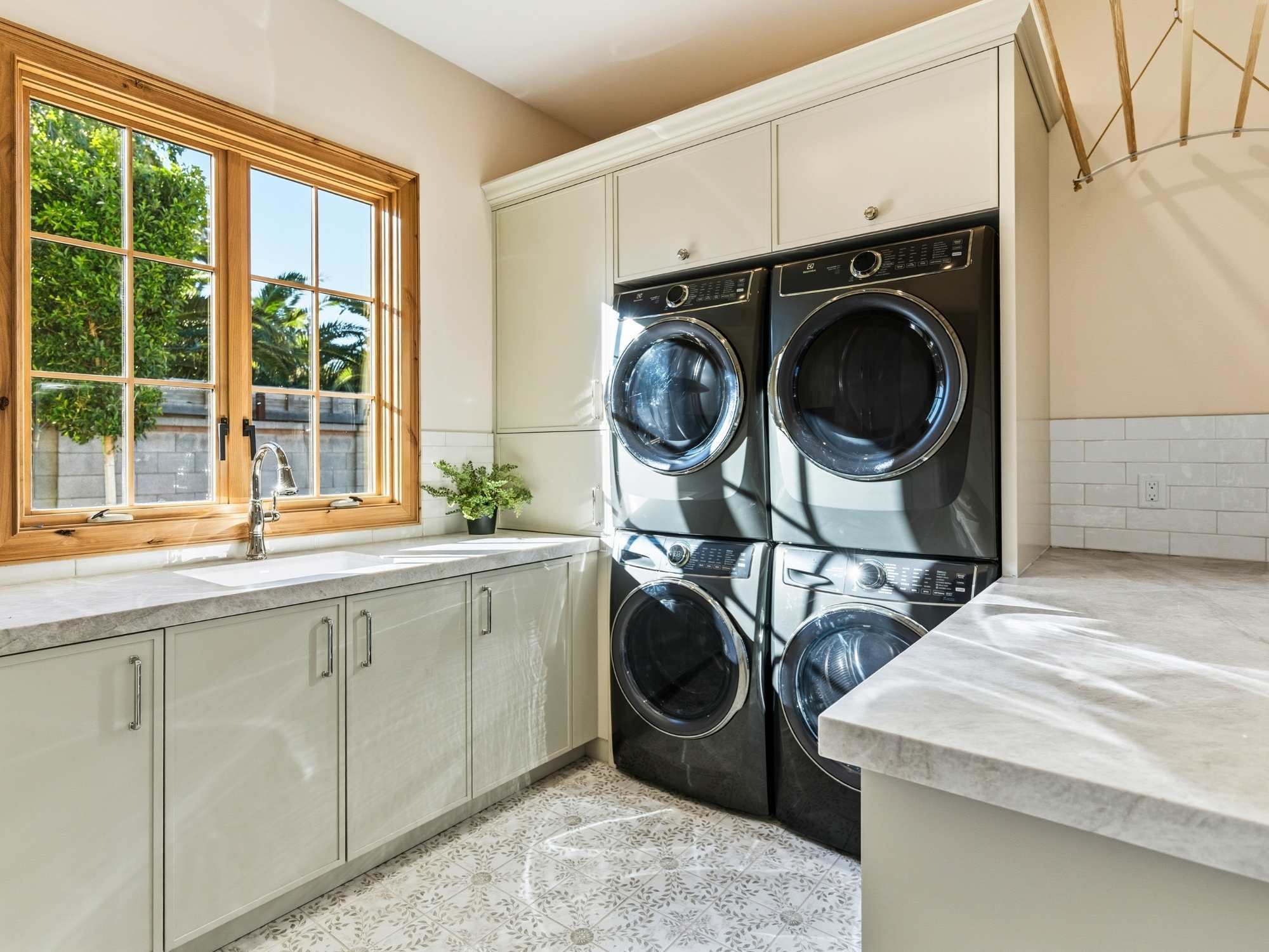 The utility room with sink and custom cabinets by Trinity Homes AZ
