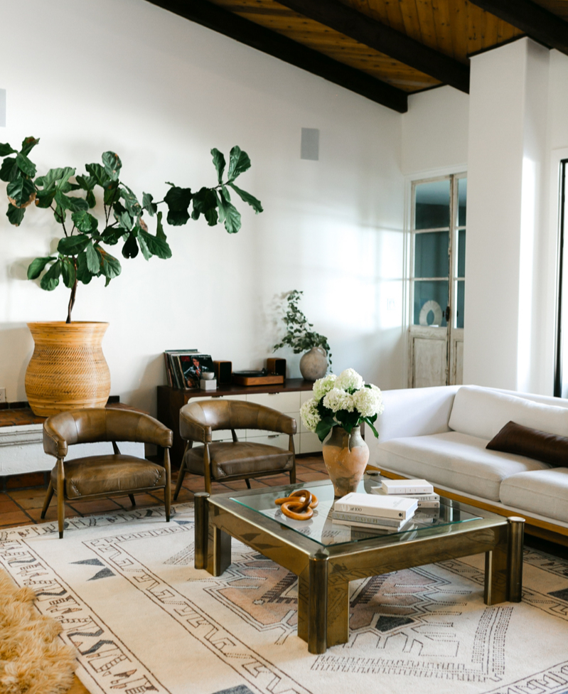 Cozy living room in Phoenix remodeled by Trinity Homes with leather chairs and wood-beam ceiling Cozy living room in Phoenix remodeled by Trinity Homes with leather chairs and wood-beam ceiling