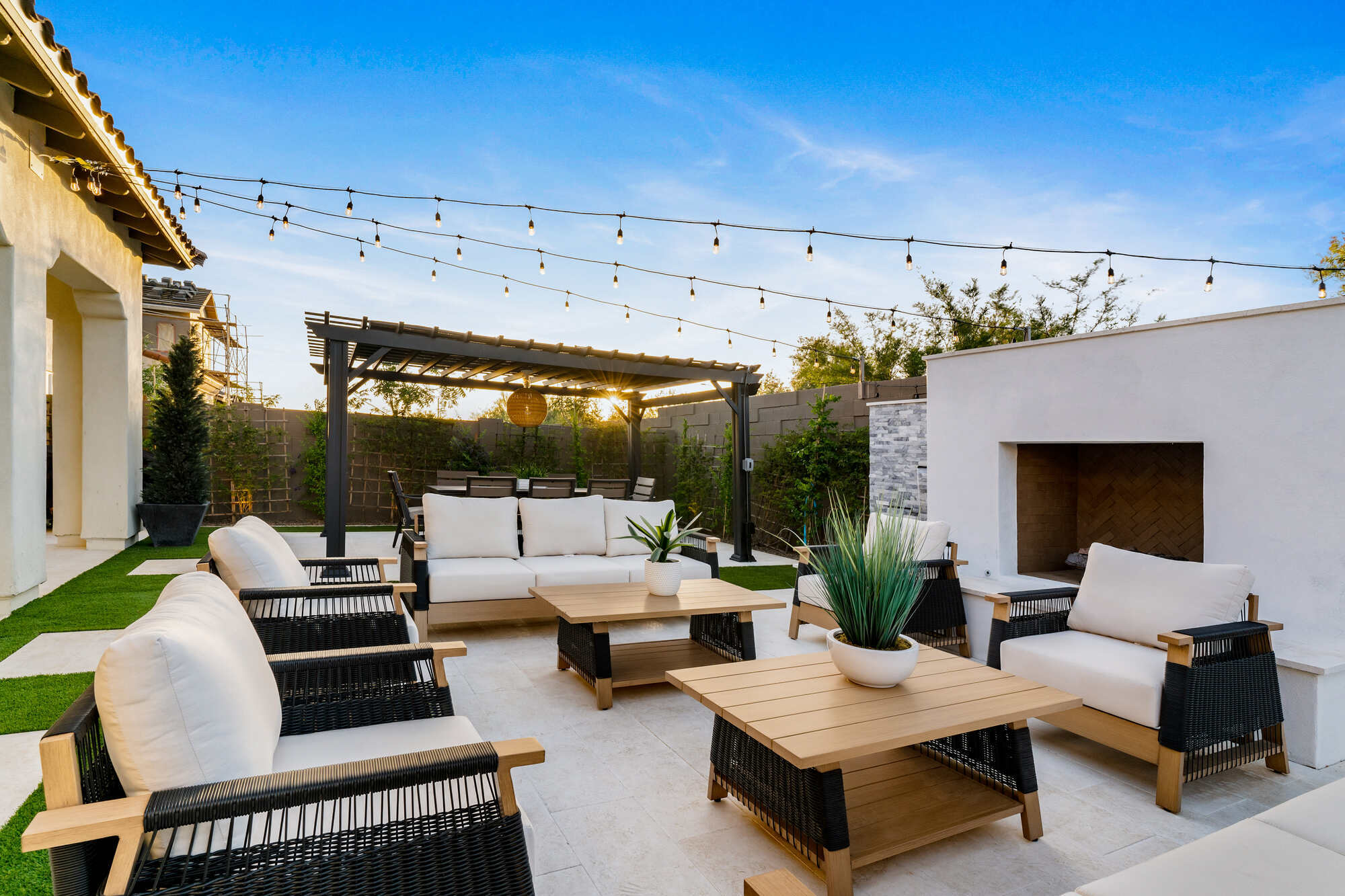 Modern pergola-covered patio dining area from a Phoenix, AZ partial remodel by Trinity Homes