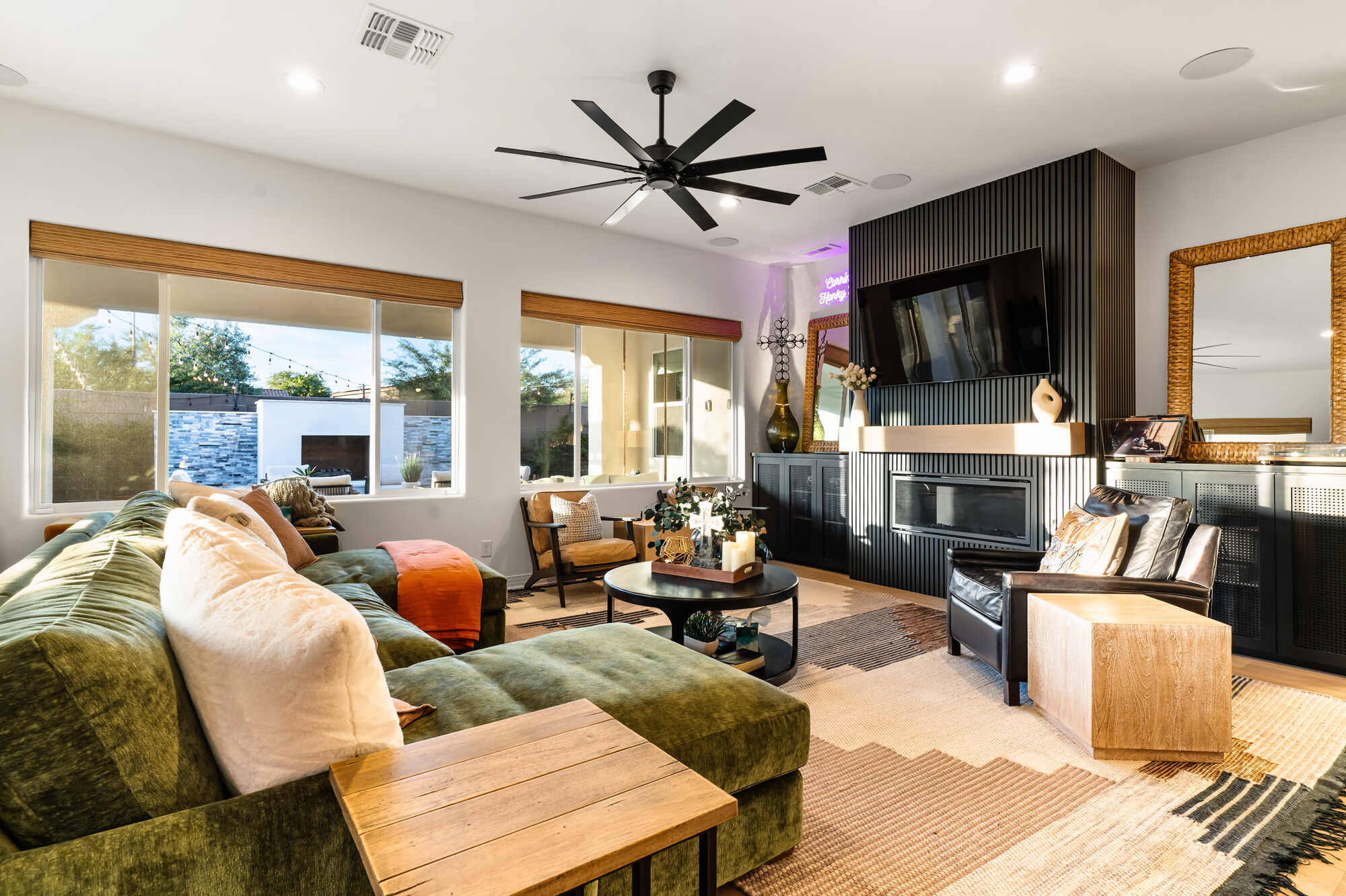 Trinity Homes partial remodel in Phoenix featuring a modern living room with fireplace and large sectional