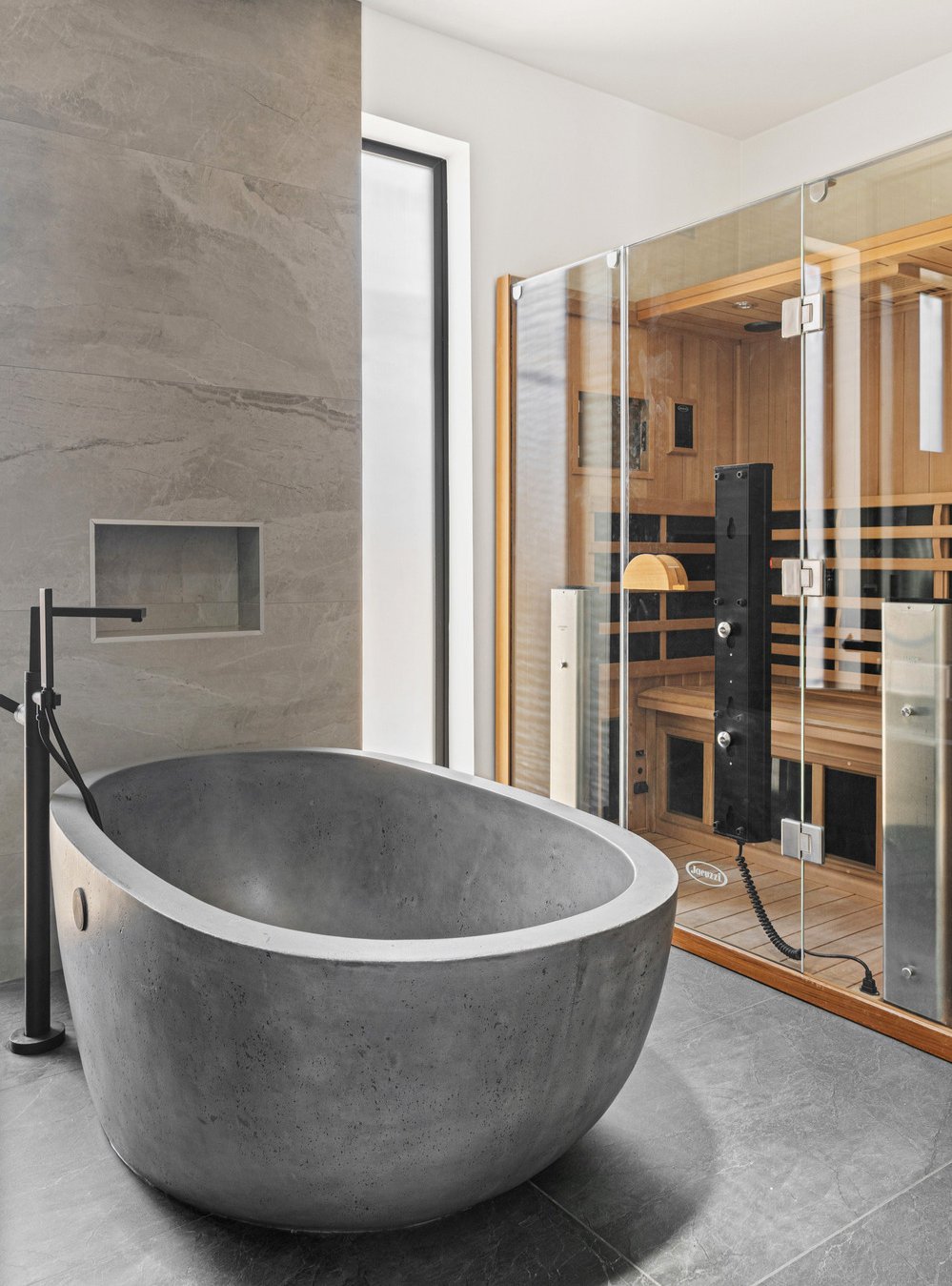 Modern bathroom with free-standing stone tub and sauna in Scottsdale, AZ