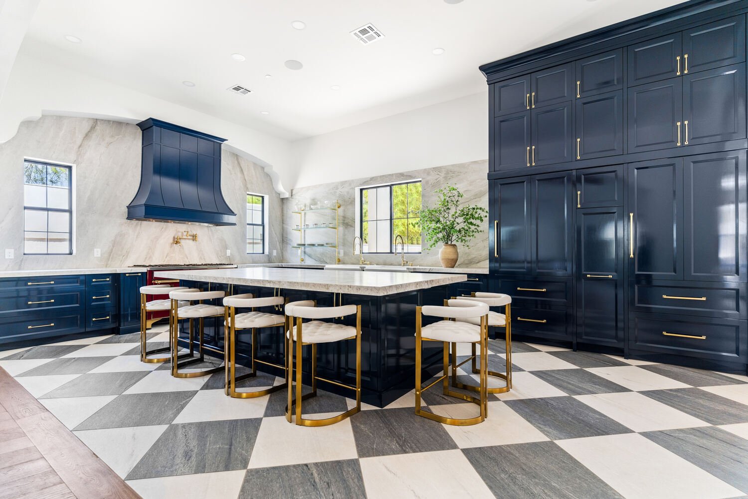 Bright Scottsdale kitchen remodel with bold blue cabinetry and brass fixtures by Trinity Homes