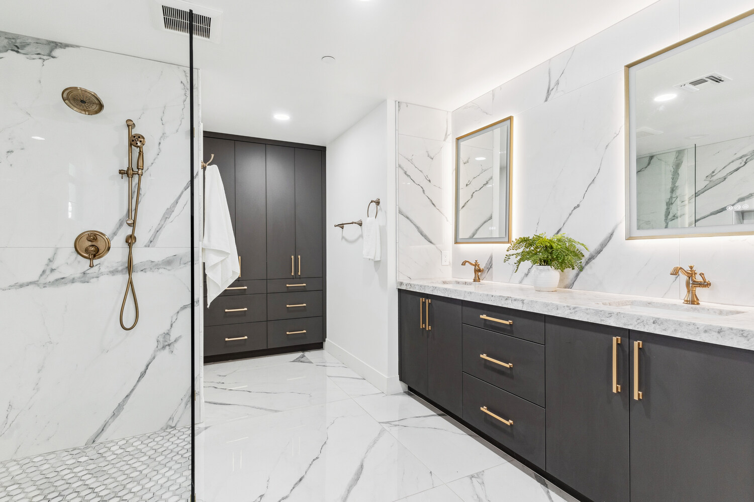 Trinity Homes master bathroom remodel in Scottsdale AZ with dual vanity and brass fixtures