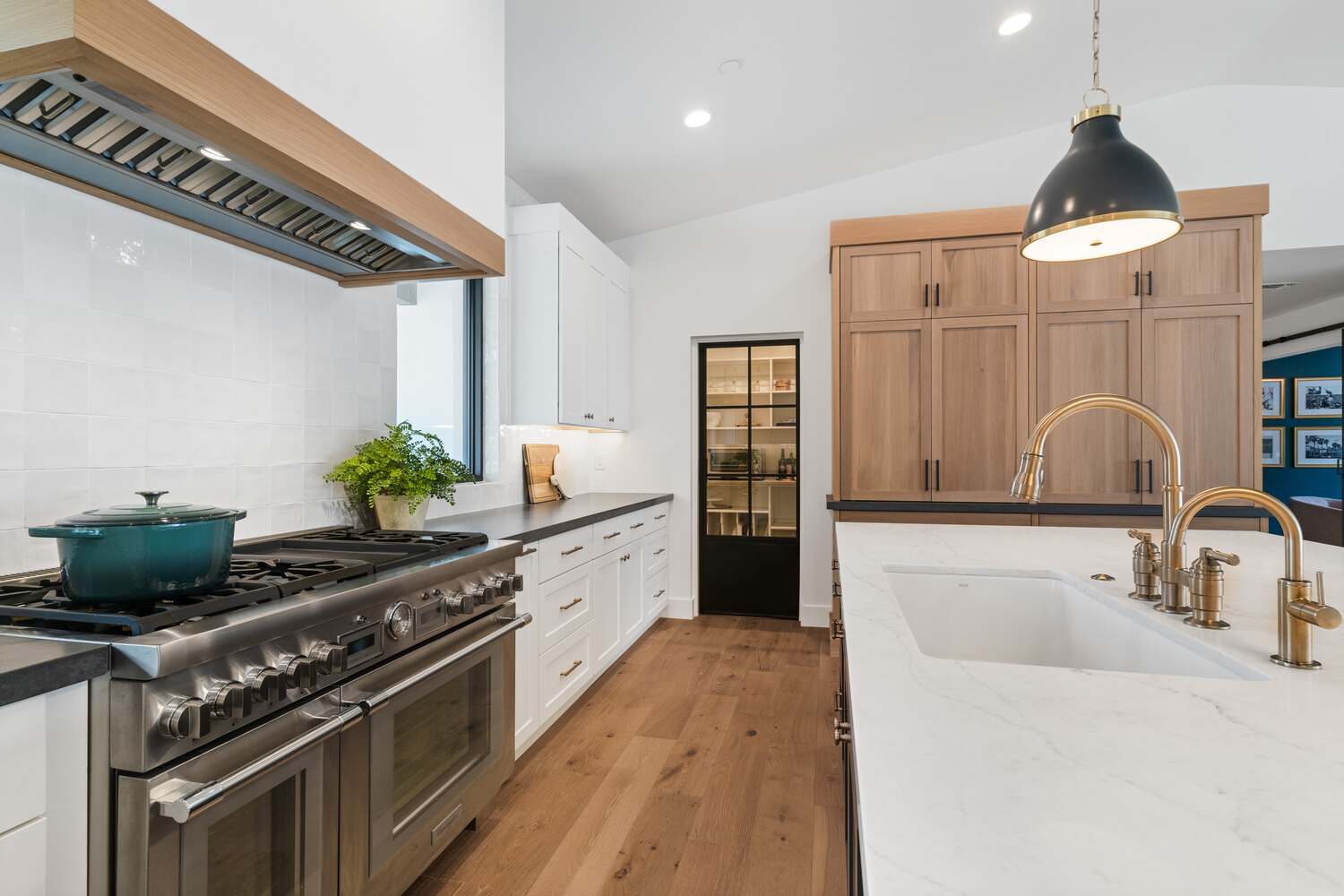 Updated kitchen featuring white counters and high-end appliances by Trinity Homes AZ in Cave Creek, AZ
