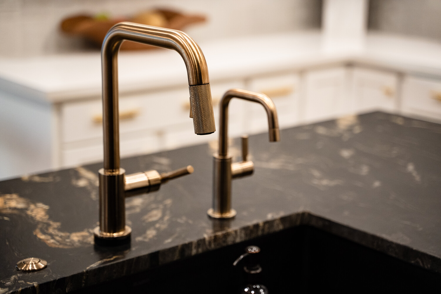 Matte black bathroom faucet on white vanity in Phoenix remodel by Trinity Homes