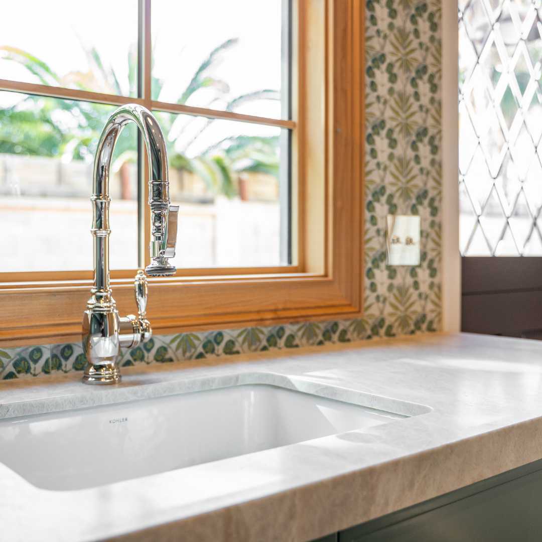 Close-up of a faucet and sink in a kitchen in paradise valley by Trinity Homes AZ