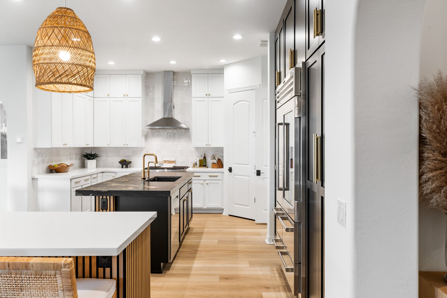 Kitchen renovation in Phoenix with floor-to-ceiling black cabinetry by Trinity Homes